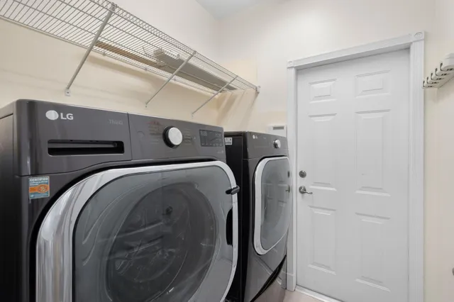 a kitchen with a refrigerator and a sink
