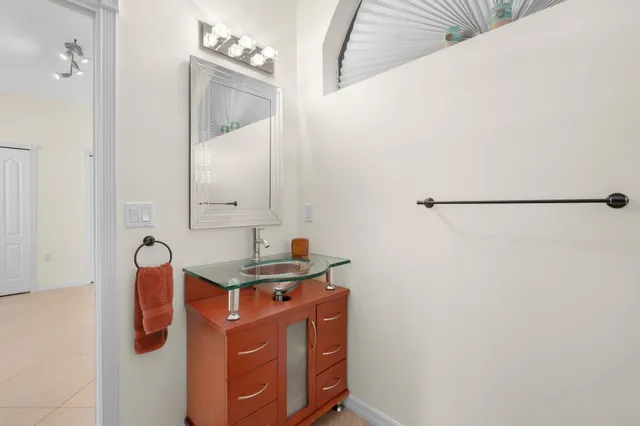 a bathroom with a glass shower door