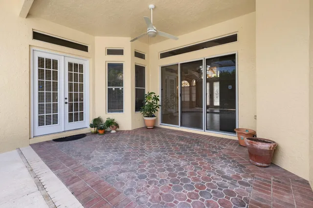 a view of a backyard with wooden fence