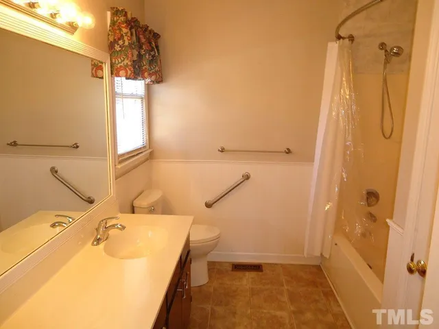 a bathroom with a sink and shower