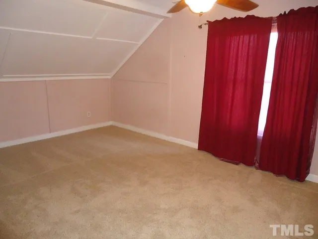 a view of a room with a small window