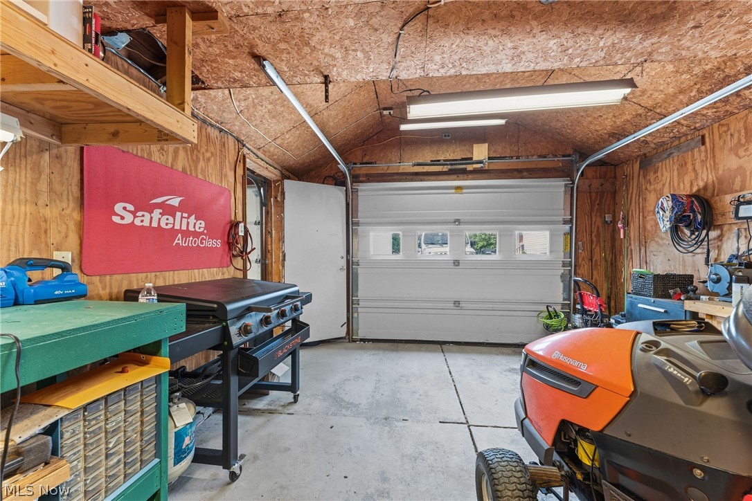 258 Randolph Road Mogadore, OH 44260 - Photo 31 of 49 Functional garage space featuring plywood walls and ceiling
