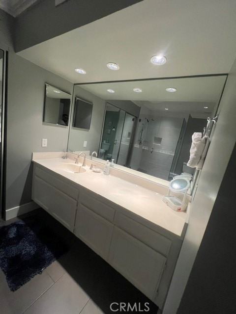 36 El Toro Drive Rancho Mirage, CA 92270 - Photo 2 of 25 a bathroom with a sink and a mirror