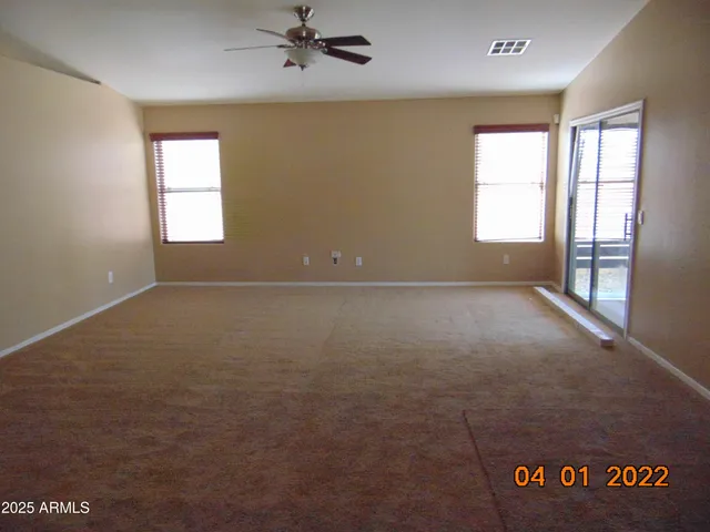 a view of a kitchen with a sink and cabinets