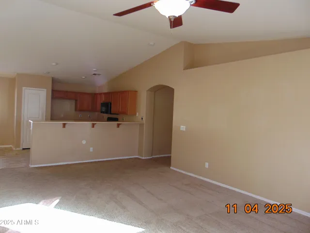 a view of a kitchen with a sink and cabinets