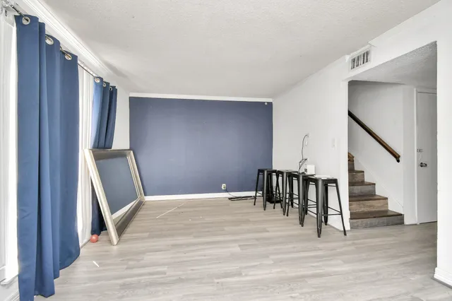 a view of a hallway with staircase