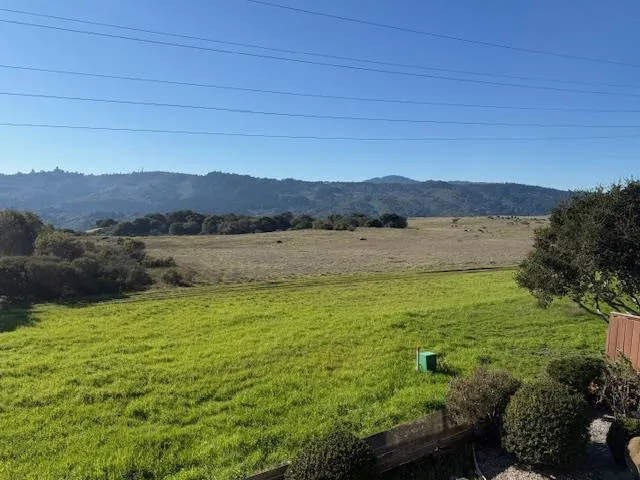 a kitchen with a stove sink and cabinets