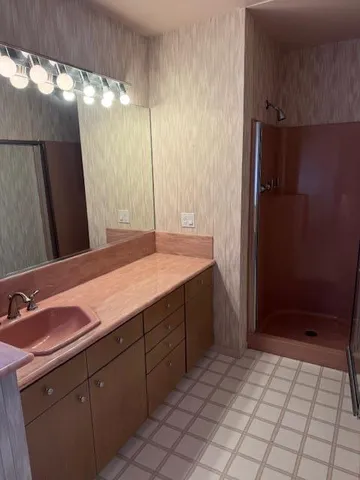 an empty room with large windows