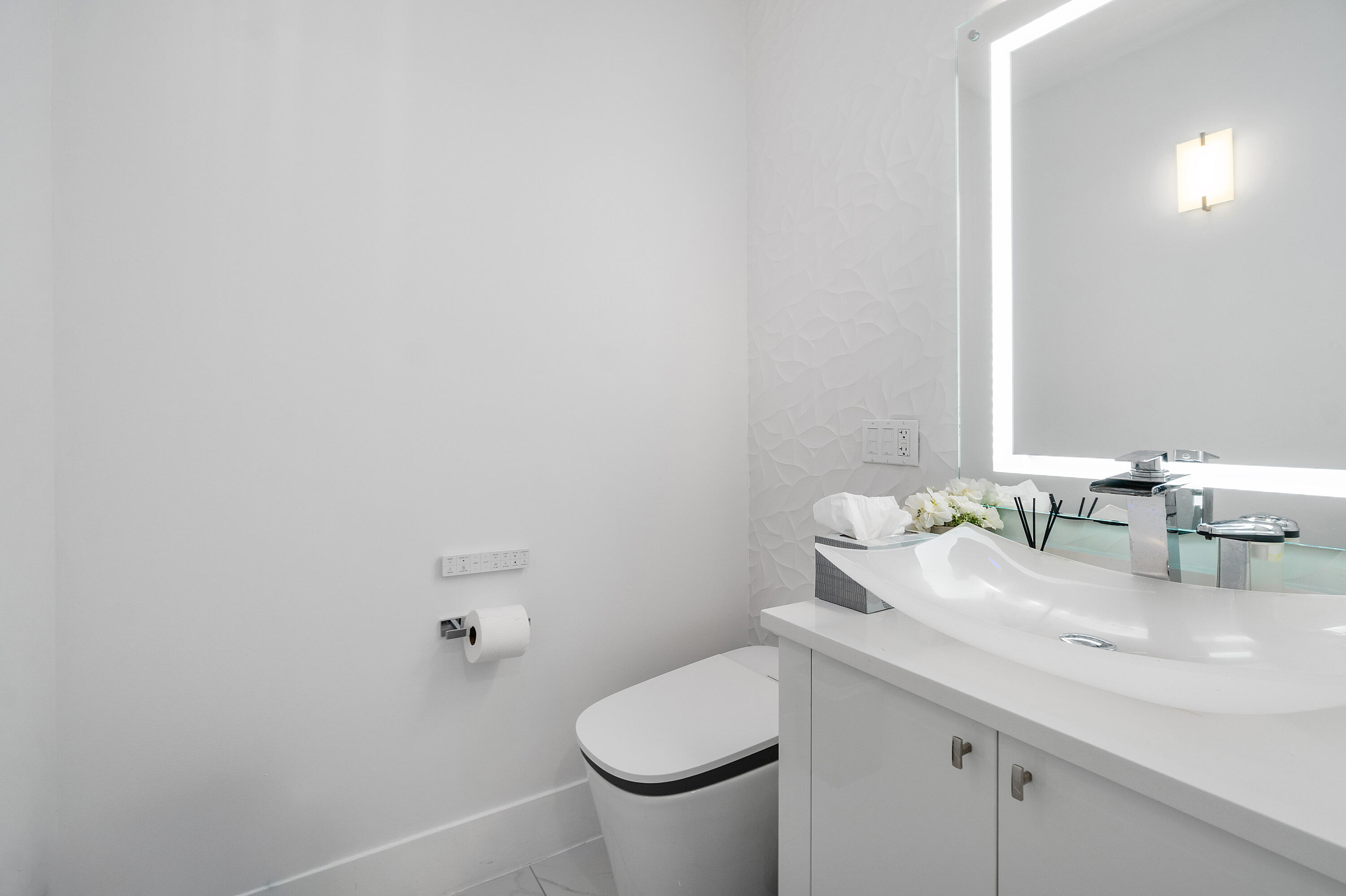 5447 Center Street Jupiter, FL 33458 - Photo 29 of 60 a bathroom with a granite countertop toilet and a sink