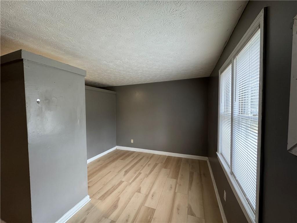 1410 Cave Spring Road Southwest Rome, GA 30161 - Photo 11 of 13 a view of wooden floor in an empty room