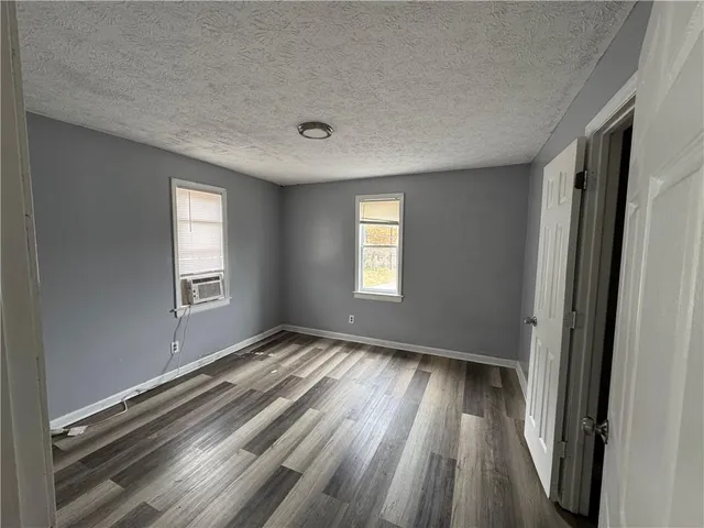 a kitchen with a refrigerator and a stove top oven