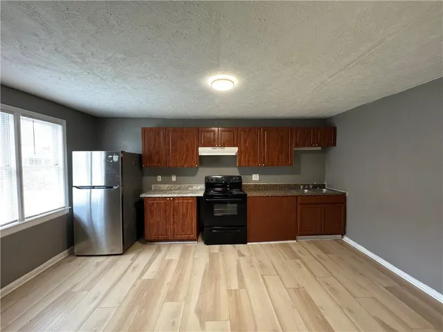 a view of wooden floor in an empty room