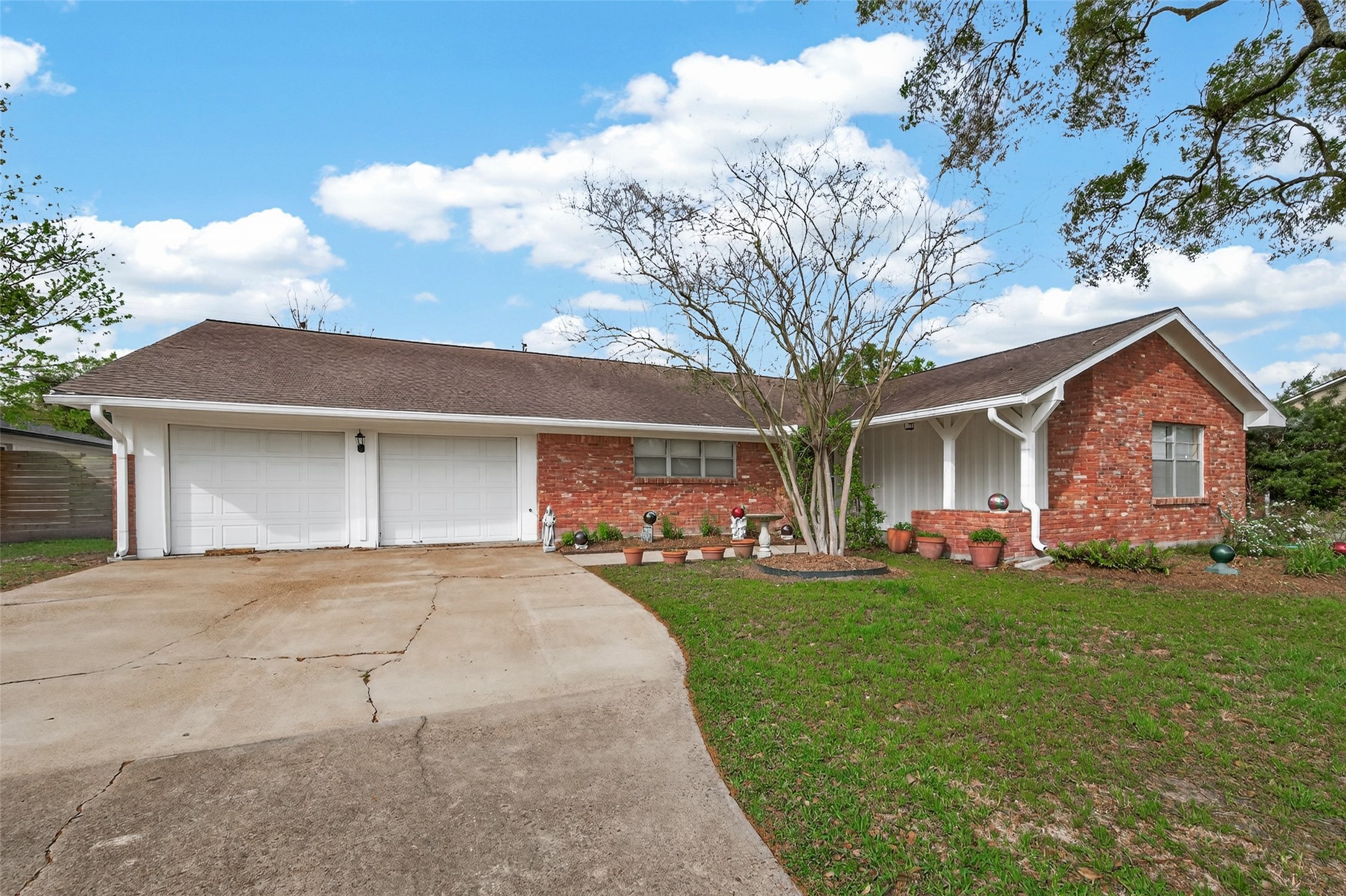 5646 Hazen Street Houston, TX 77081 - Photo 2 of 43 This charming single-story brick home offers a two-car garage and a large driveway.