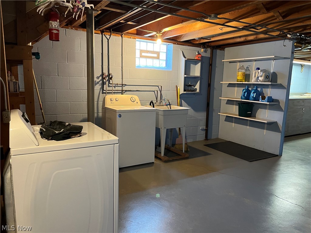 13604 Alexander Road Cleveland, OH 44125 - Photo 39 of 49 Laundry room with sink. Washer stays; Dryer does not.