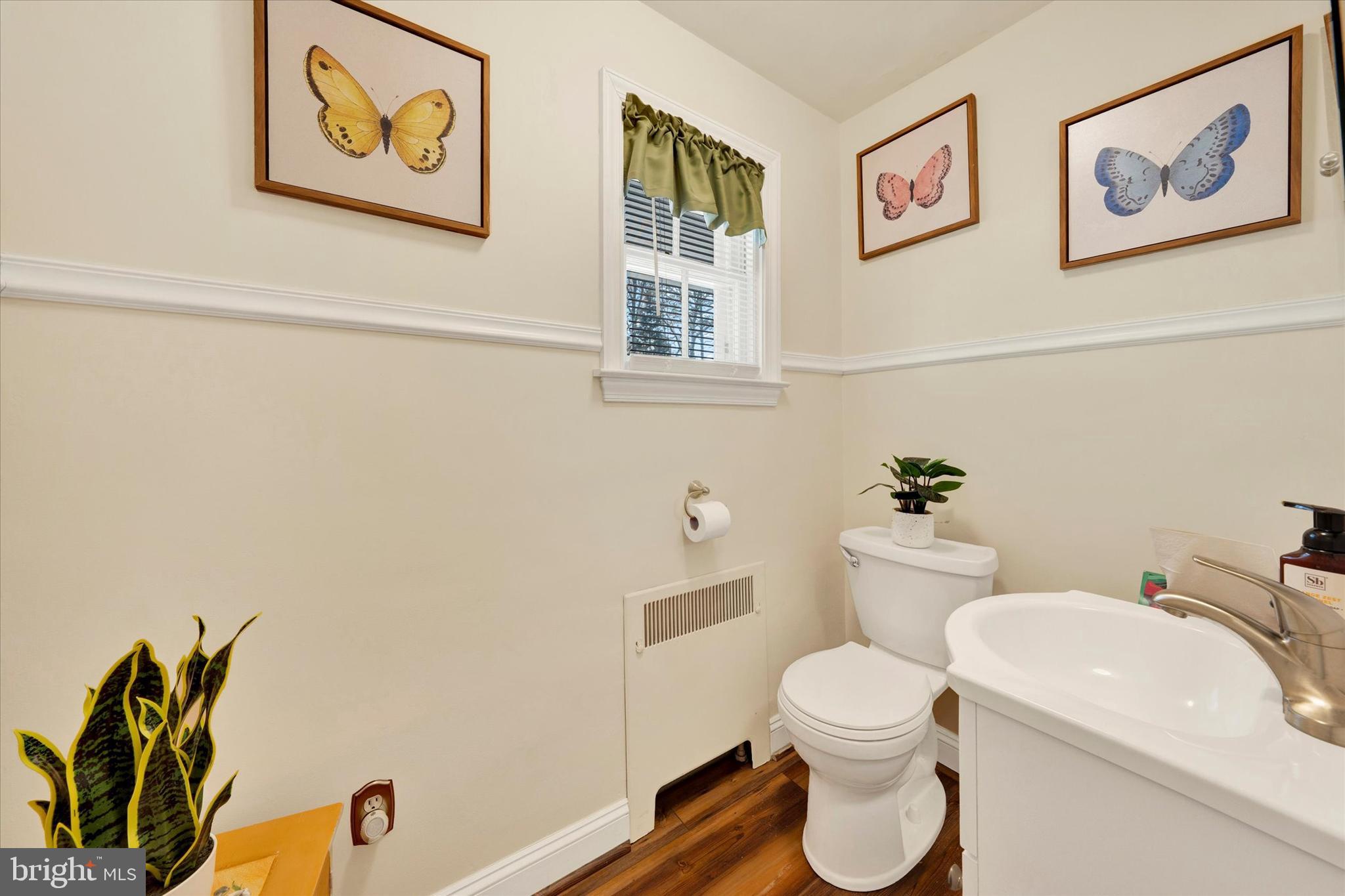1406 Farr Road Reading, PA 19611 - Photo 12 of 29 a white toilet sitting next to a bathroom sink and vanity