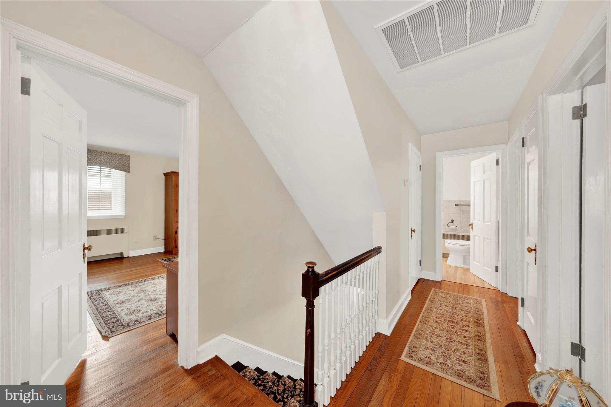 1406 Farr Road Reading, PA 19611 - Photo 16 of 29 a view of a hallway with wooden floor and staircase