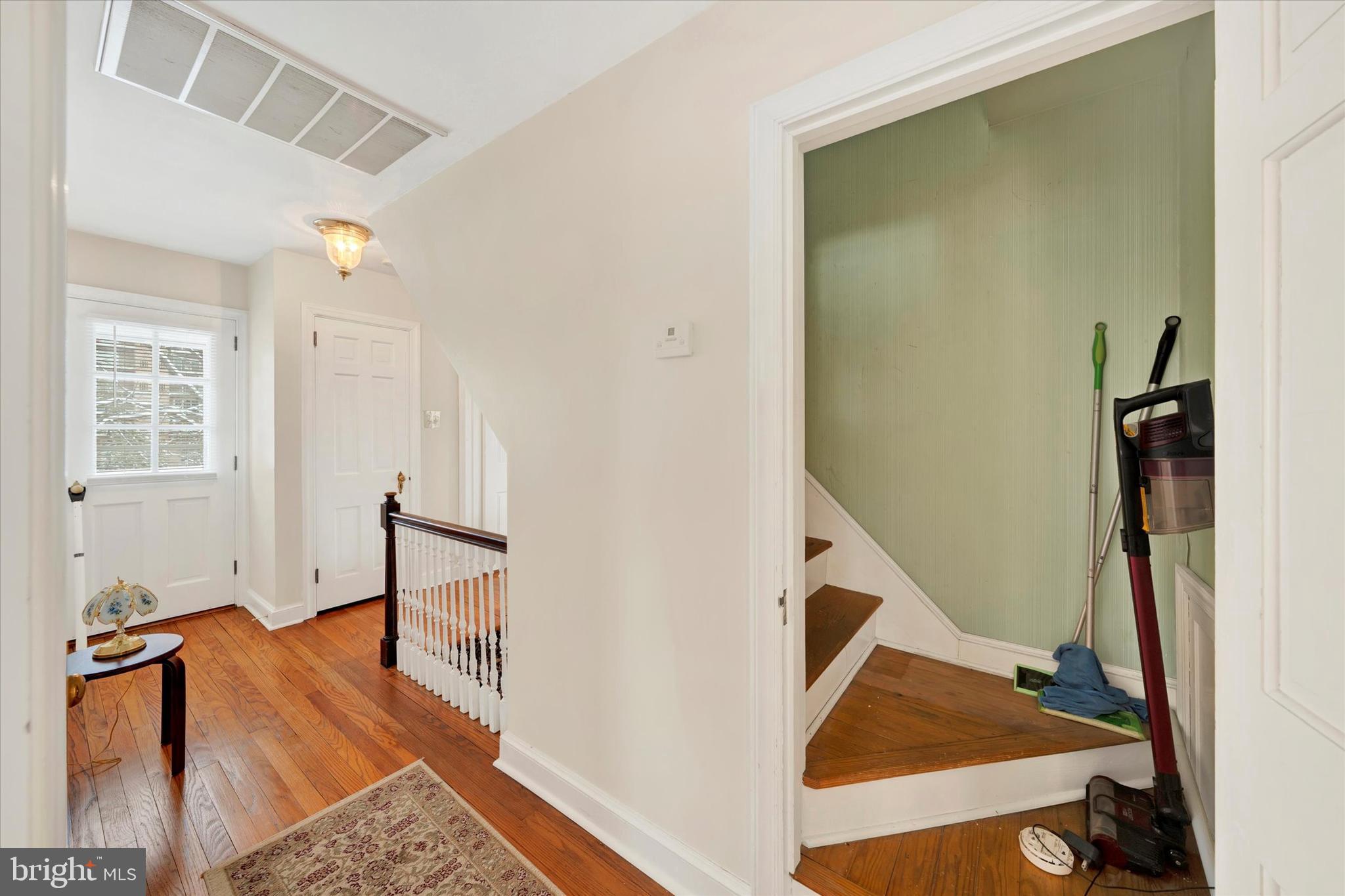 1406 Farr Road Reading, PA 19611 - Photo 26 of 29 a view of a hallway with wooden floor and staircase
