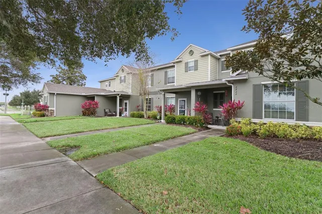 a front view of house with yard and green space