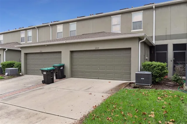 a couple of potted plants in front of building