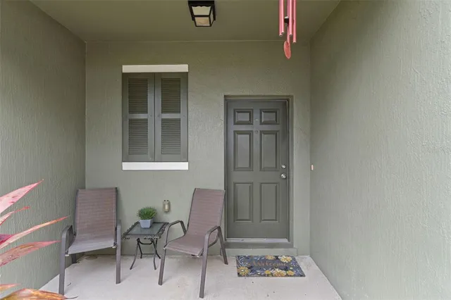 a view of a livingroom with furniture and windows