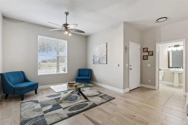 a living room with furniture and a window