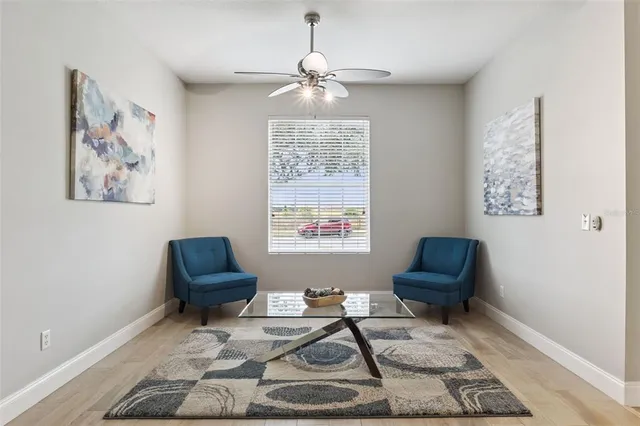 a living room with furniture and a window