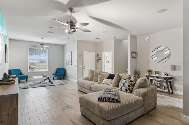a living room with furniture or outdoor view and a chandelier