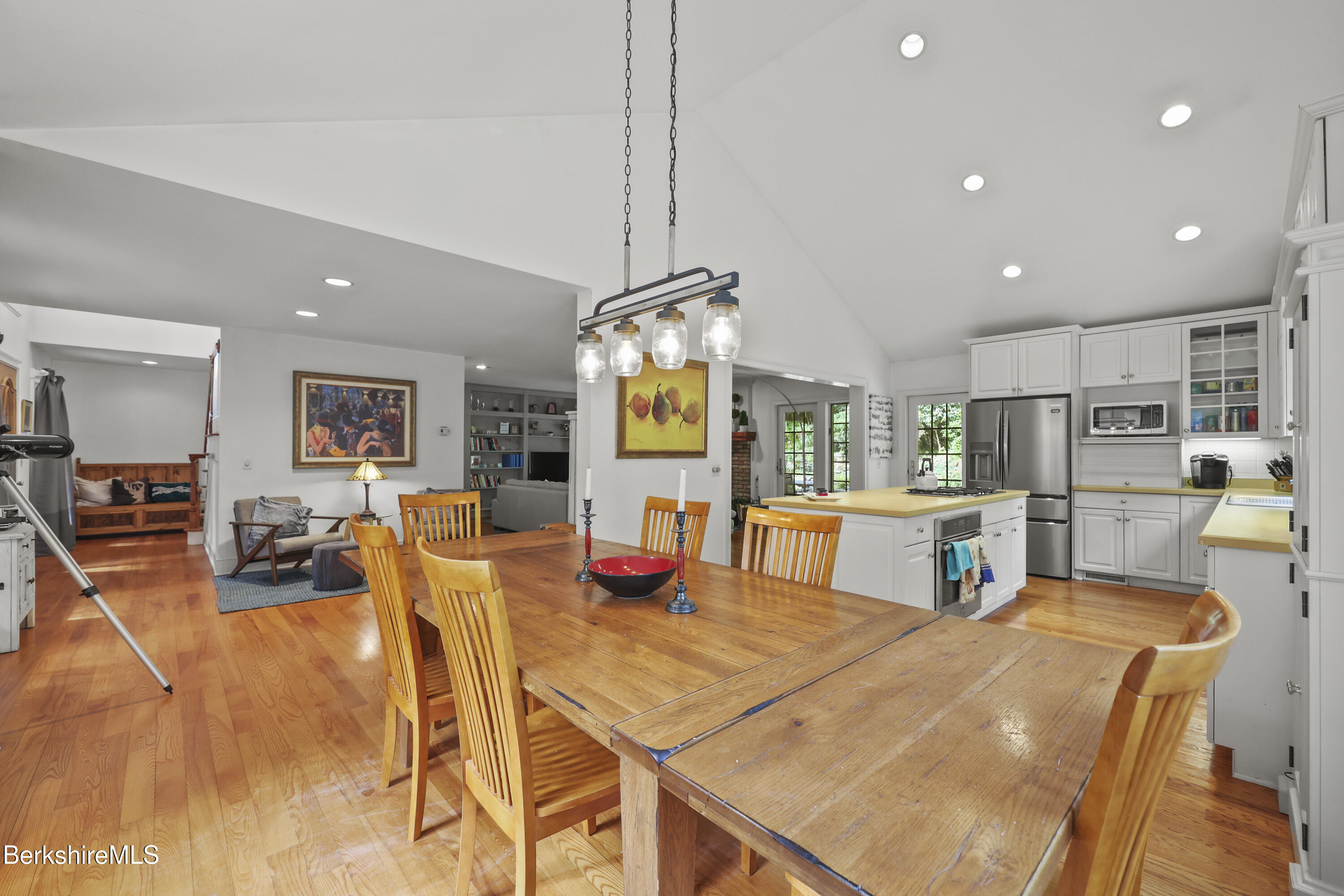 905 W Road Sheffield, MA 01230 - Photo 18 of 60 a view of a dining room with furniture and a chandelier
