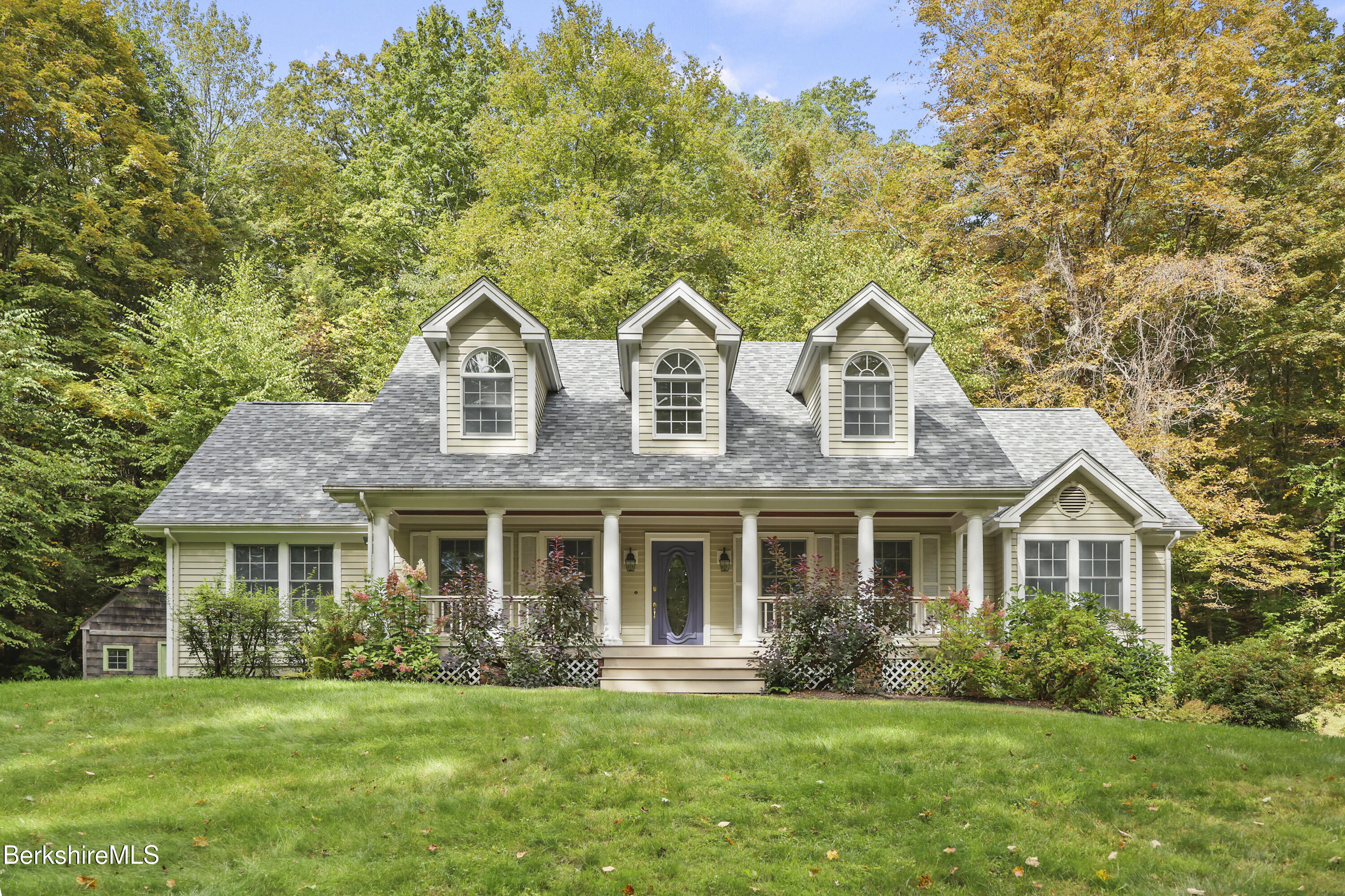 905 W Road Sheffield, MA 01230 - Photo 2 of 60 a front view of a house with a yard and porch