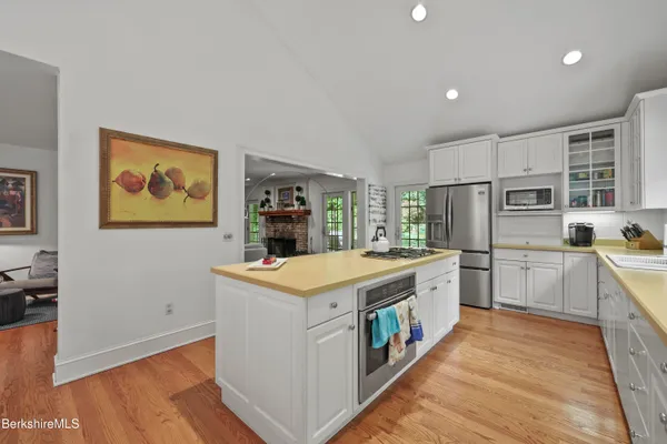 a kitchen with a sink and refrigerator