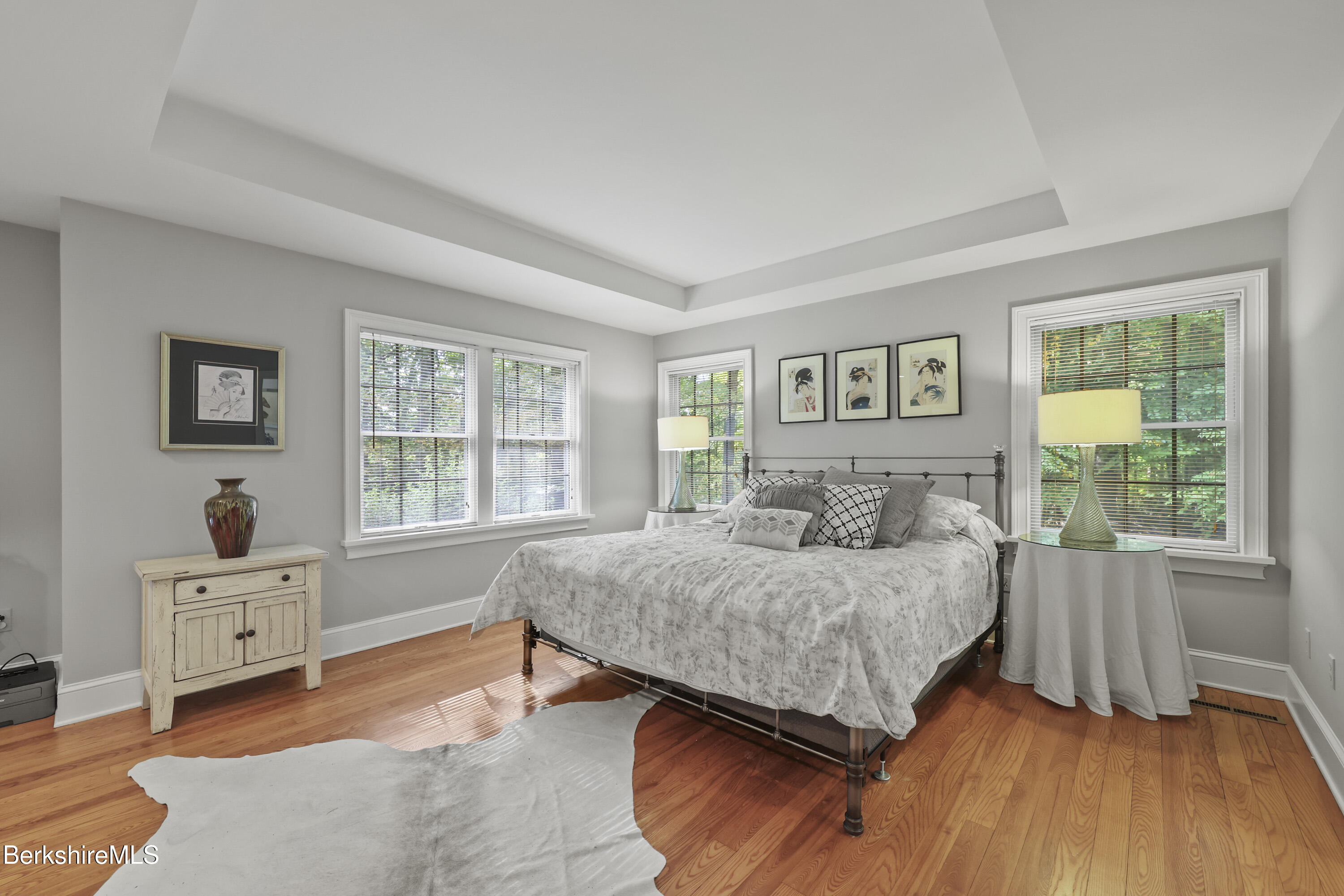 905 W Road Sheffield, MA 01230 - Photo 25 of 60 a bedroom with a bed and a dresser next to a window
