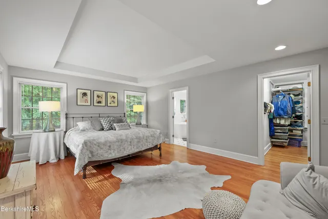 a white bath tub sitting in a bathroom next to a window