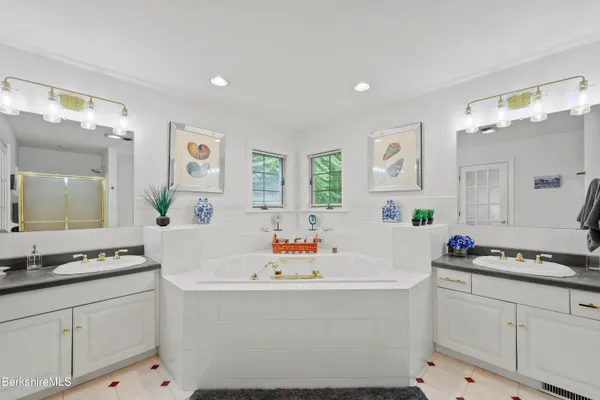 a bedroom with two beds and a table