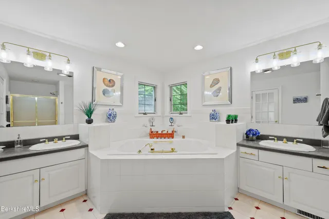 a bedroom with two beds and a table