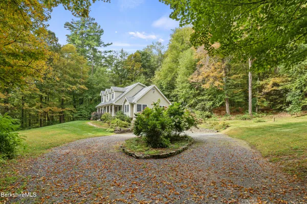 a view of a garden with a house