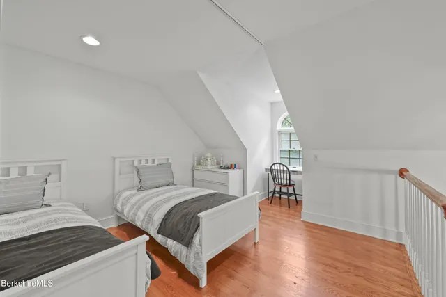 a bed room with a bed and a large window