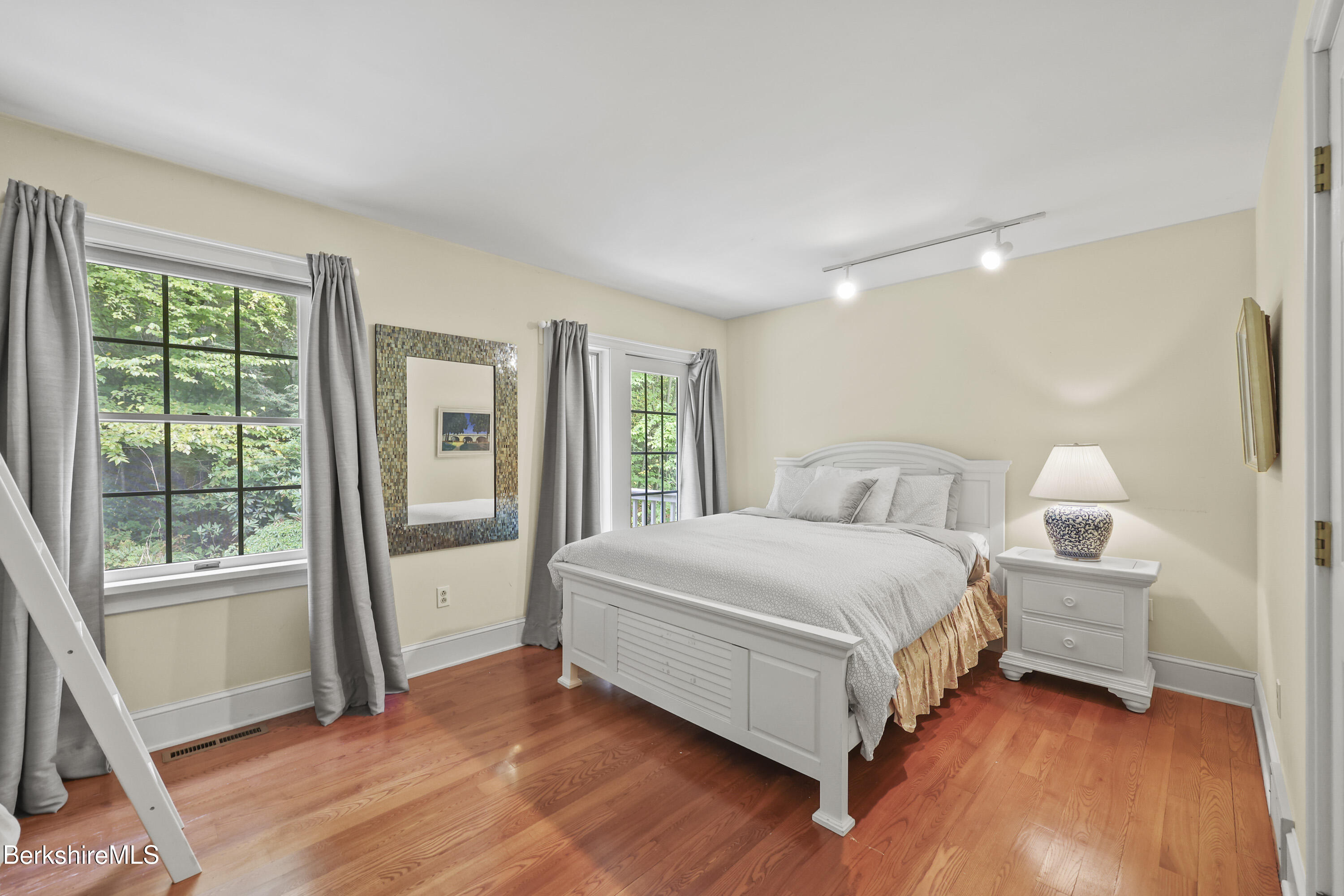 905 W Road Sheffield, MA 01230 - Photo 36 of 60 a bed room with a bed and a large window