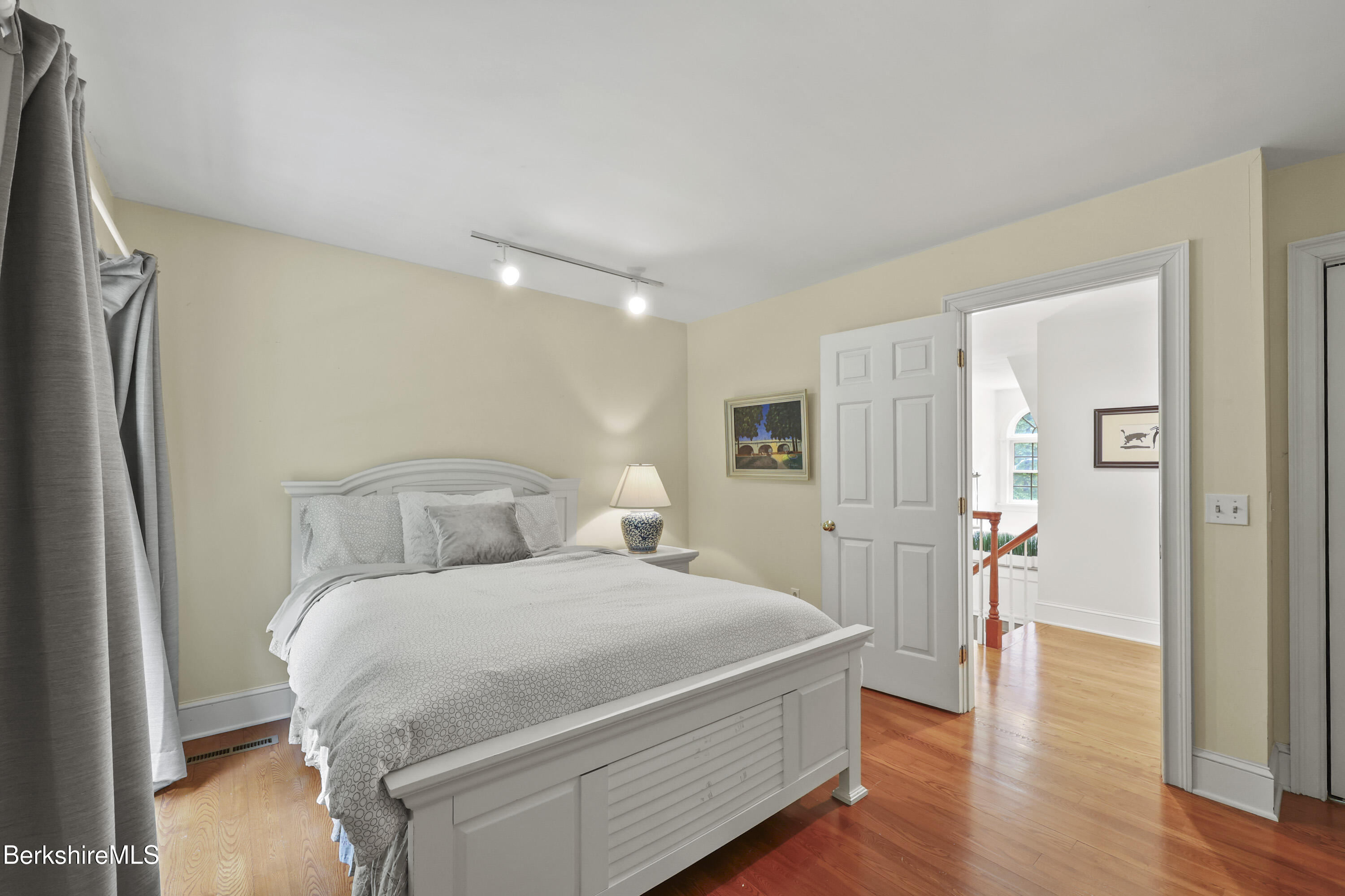 905 W Road Sheffield, MA 01230 - Photo 37 of 60 a bedroom with a bed and a mirror