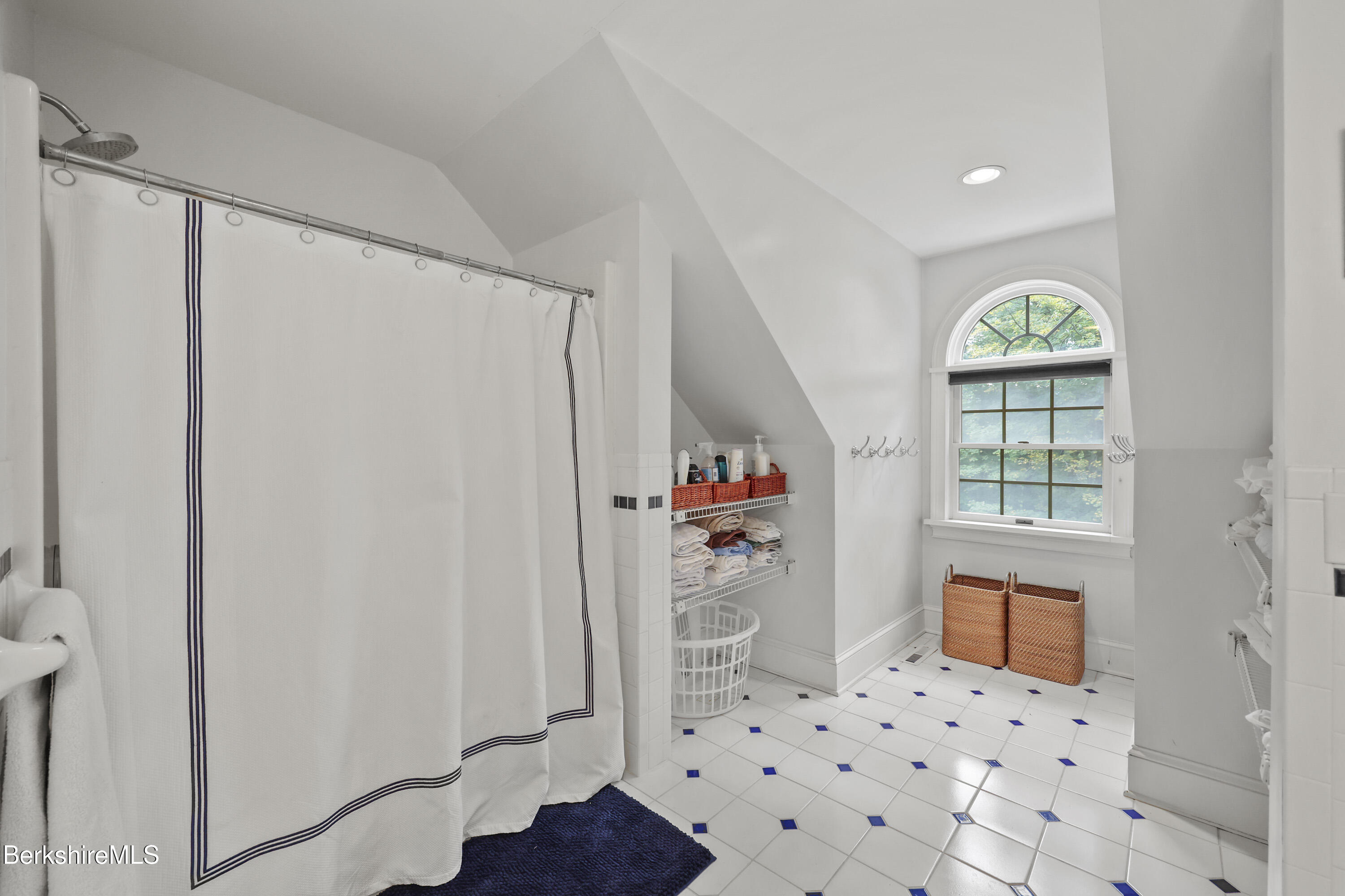 905 W Road Sheffield, MA 01230 - Photo 39 of 60 a hallway with windows and chandelier