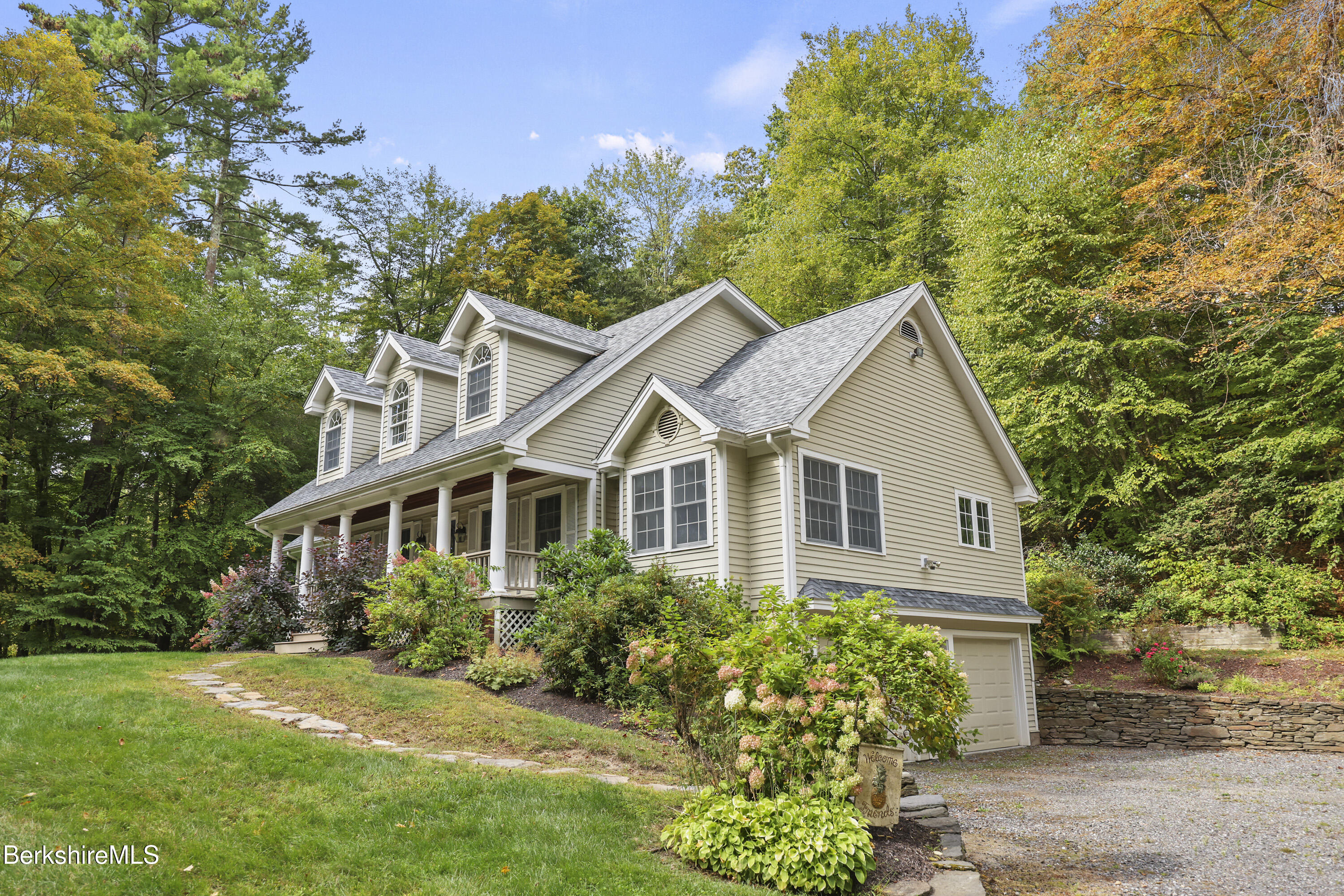 905 W Road Sheffield, MA 01230 - Photo 4 of 60 a front view of a house with a yard