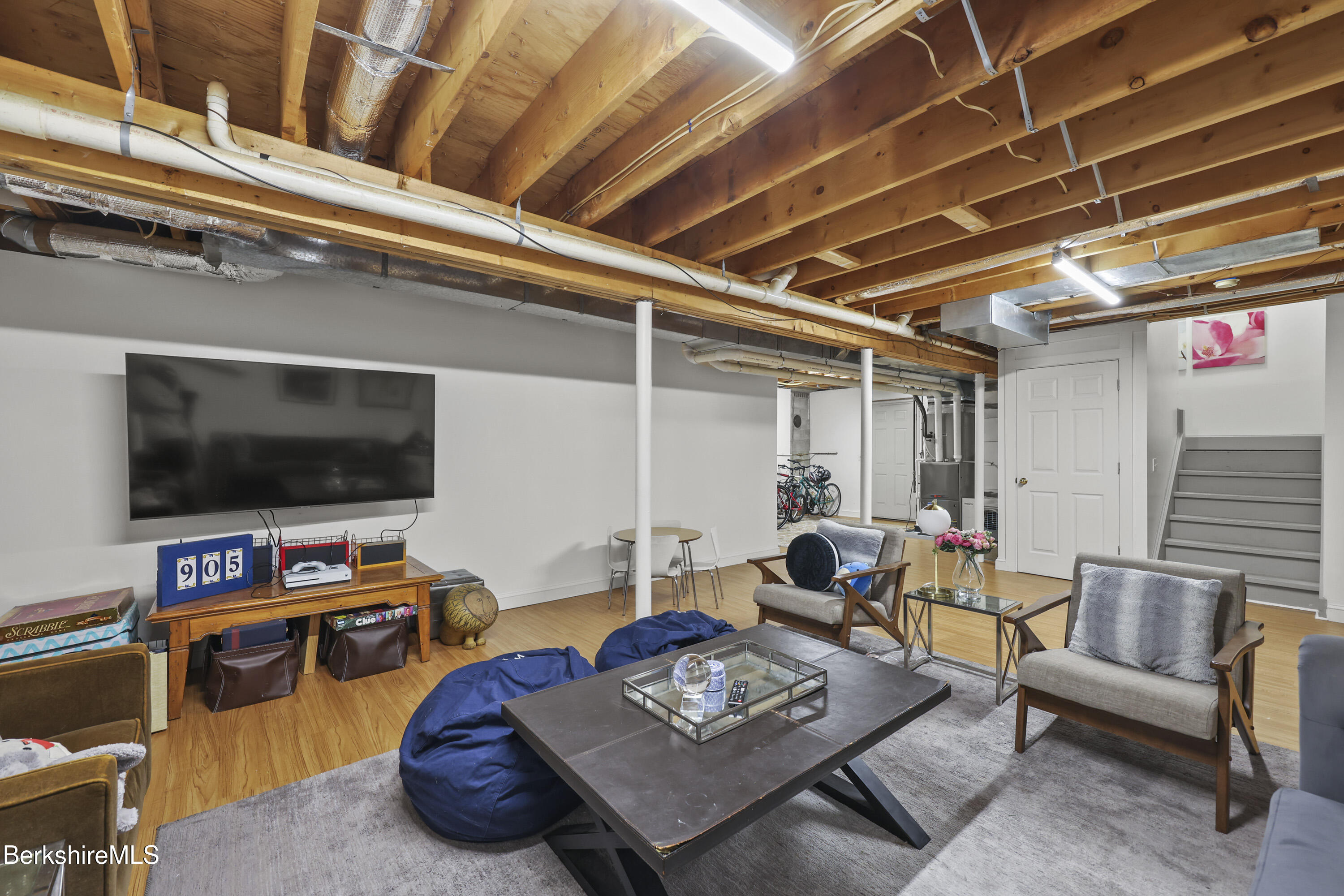 905 W Road Sheffield, MA 01230 - Photo 42 of 60 a living room with furniture and a flat screen tv