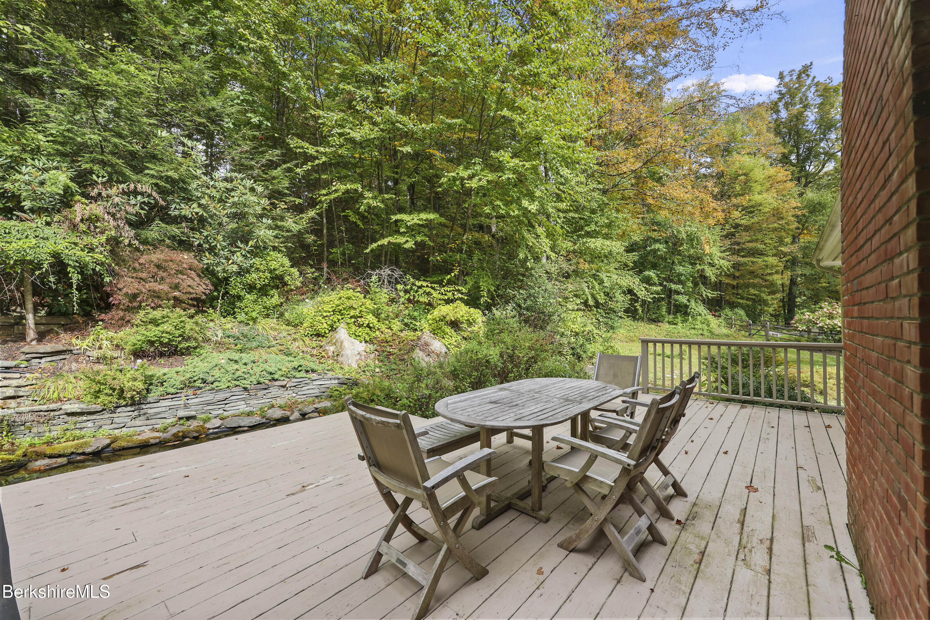 905 W Road Sheffield, MA 01230 - Photo 48 of 60 a view of a chairs and table on the wooden deck