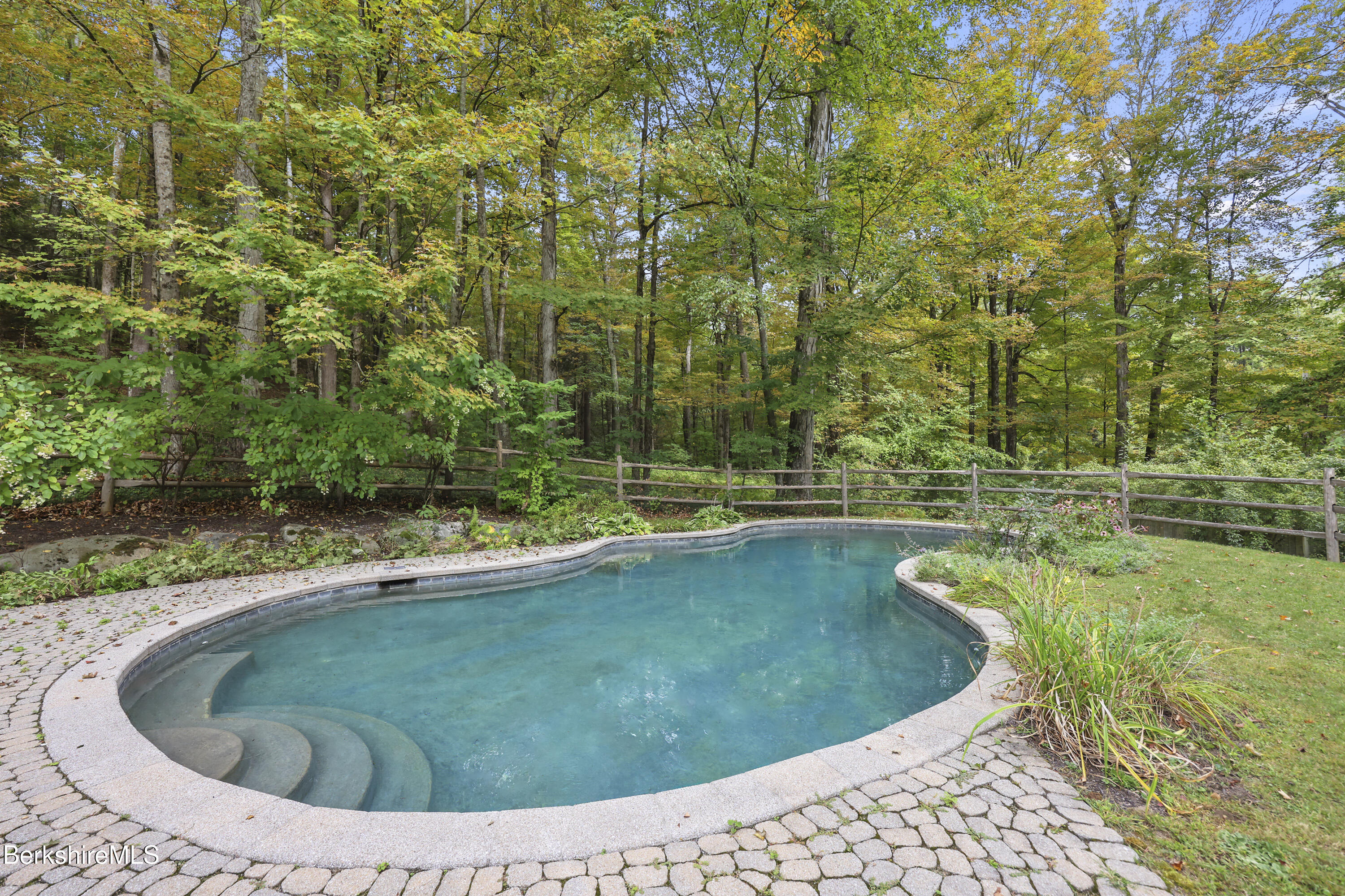 905 W Road Sheffield, MA 01230 - Photo 51 of 60 a view of a swimming pool with a yard