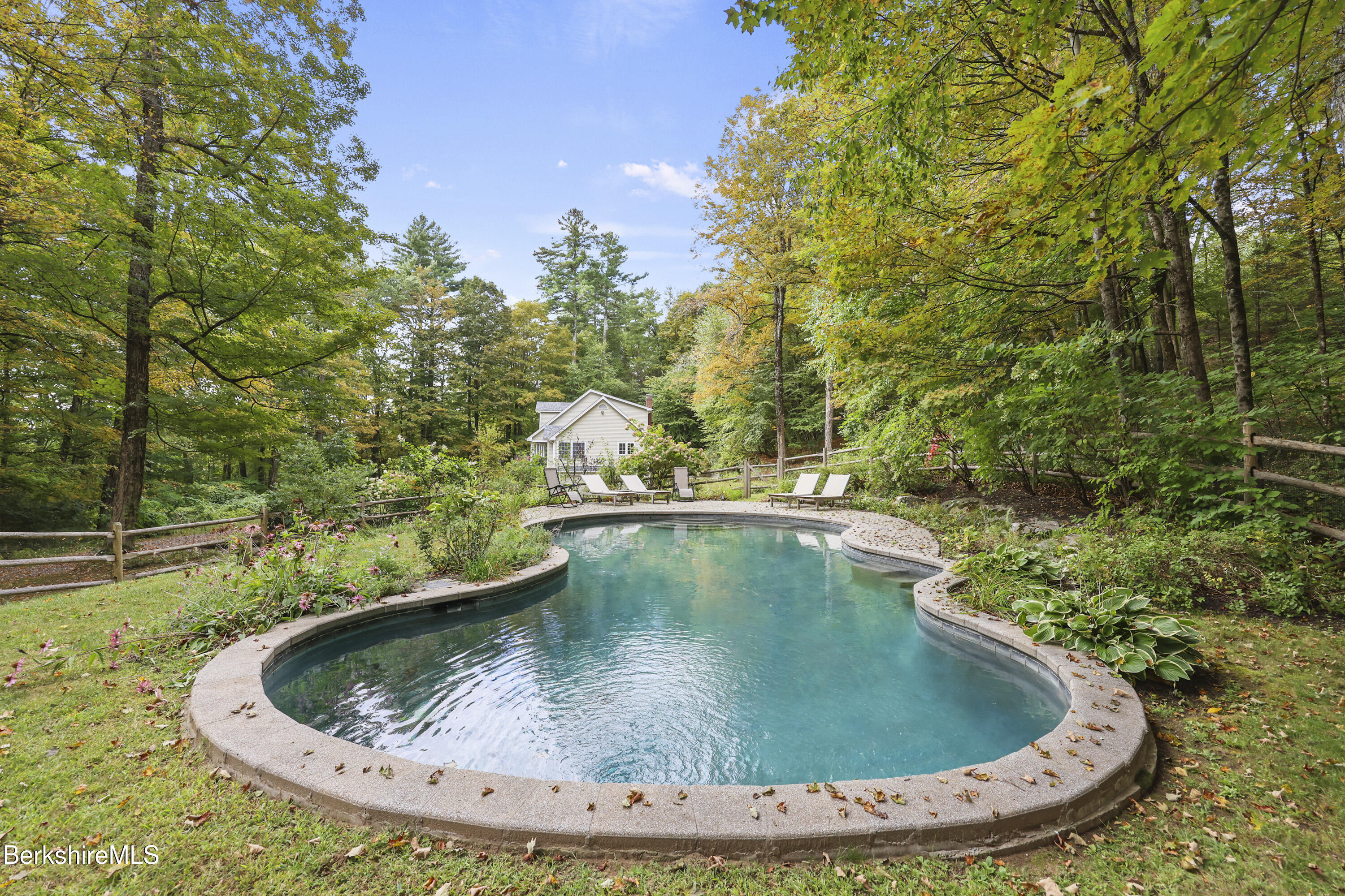 905 W Road Sheffield, MA 01230 - Photo 52 of 60 a view of a swimming pool with a yard