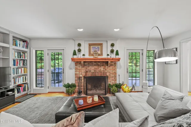 a living room with furniture and a fireplace