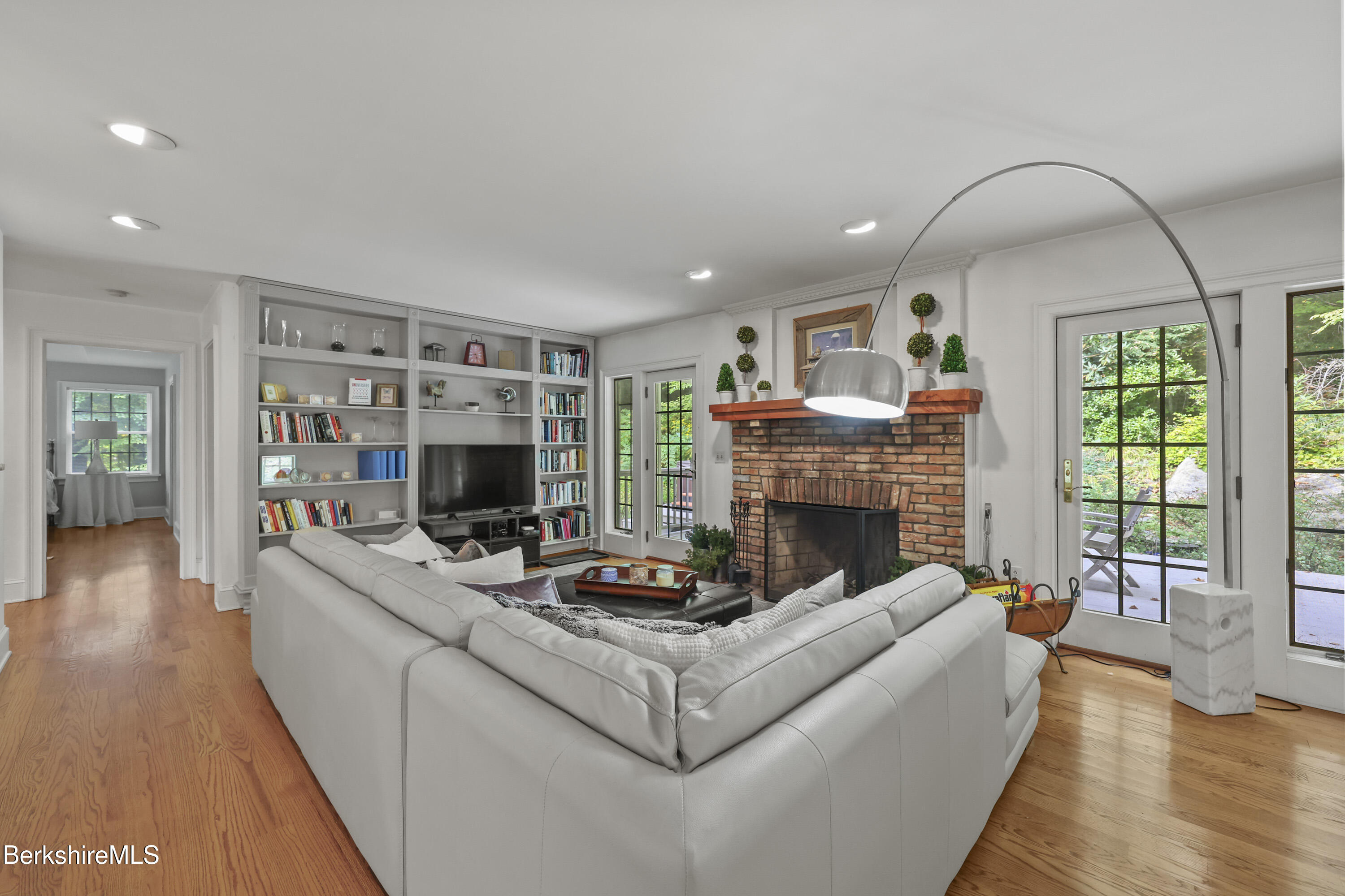905 W Road Sheffield, MA 01230 - Photo 10 of 60 a living room with furniture a fireplace and a flat screen tv
