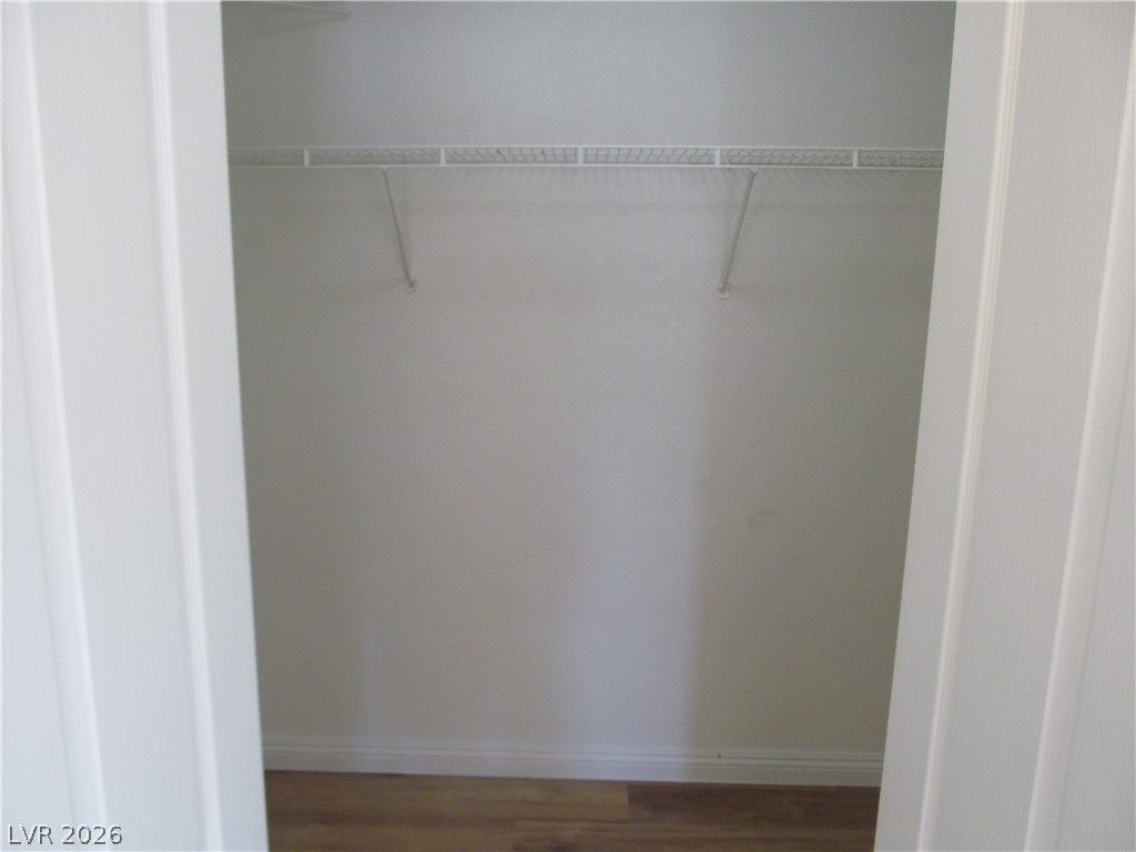 8701 Crescent Ridge Lane Las Vegas, NV 89134 - Photo 23 of 28 A well-organized closet with ample storage space and durable flooring awaits your wardrobe.