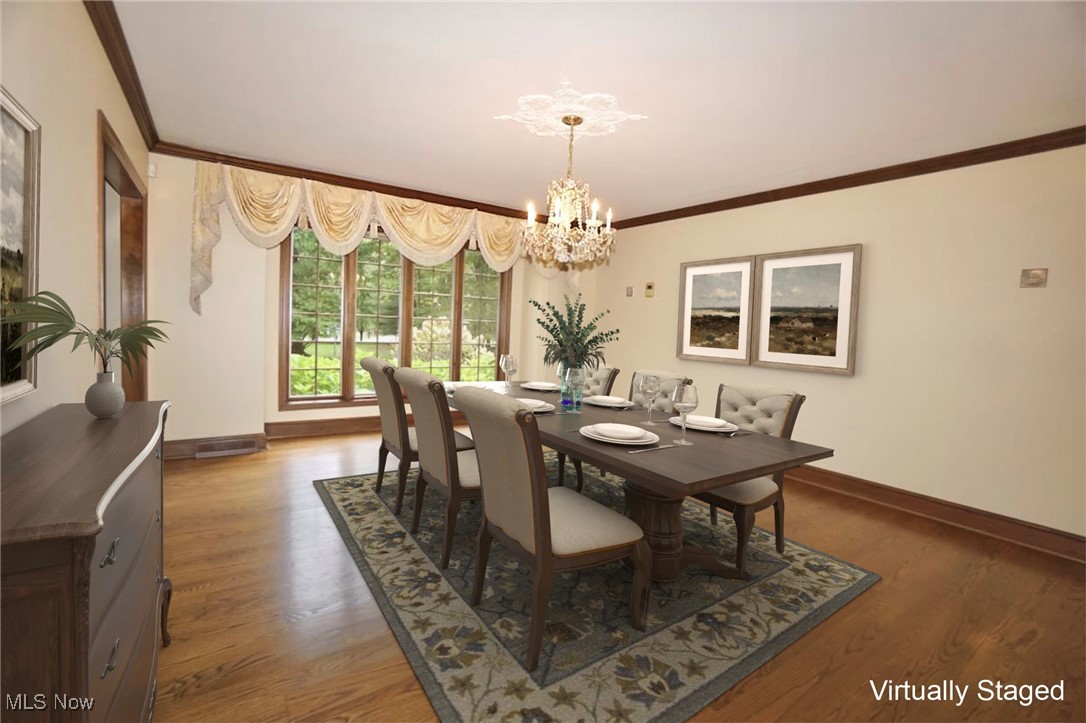 1760 Chartley Road Gates Mills, OH 44040 - Photo 11 of 49 Dining space featuring ornamental molding, a chandelier, and light wood-type flooring