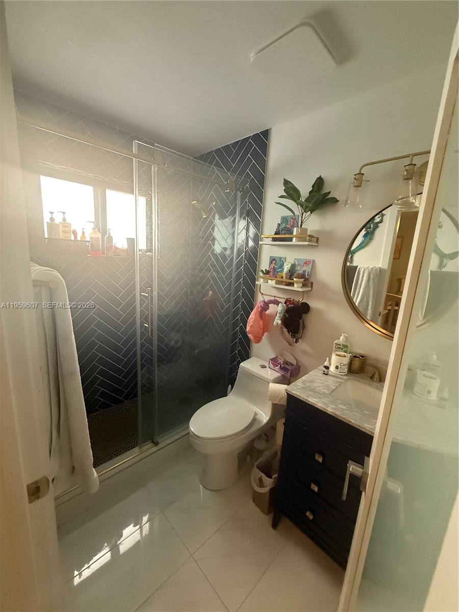 3050 Southwest 26th Street Miami, FL 33133 - Photo 9 of 11 a bathroom with a sink toilet and shower