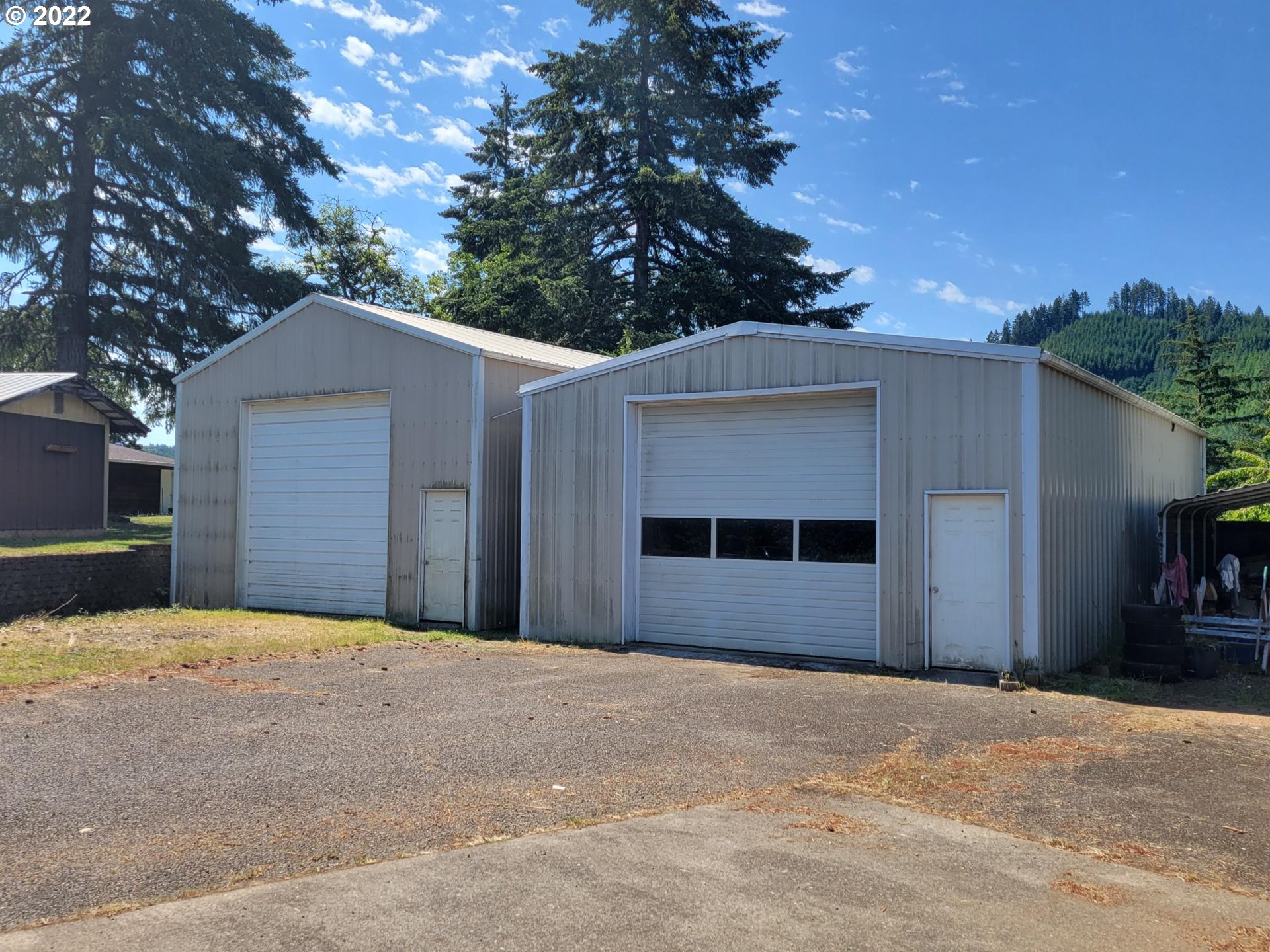 752 Cooper Creek Road Sutherlin, OR 97479 - Photo 3 of 10 a front view of a house with a yard and garage